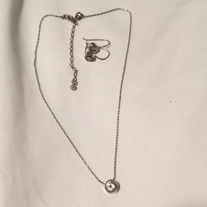 Avon pair of silver earrings and a necklace with white/clear round gem stone.